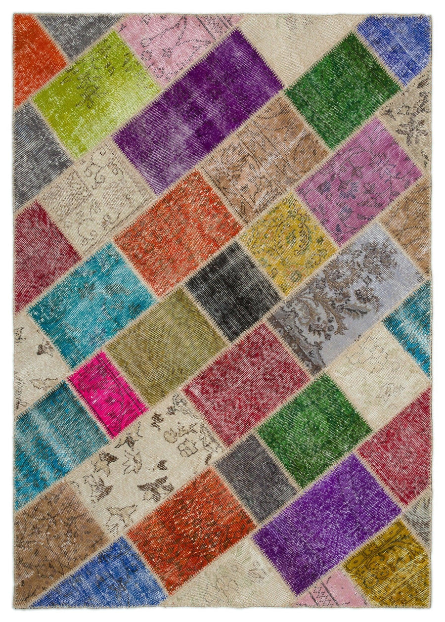 Handgeknüpfter Wollteppich in Lila & Orange 163x228 cm – im Wohnzimmer