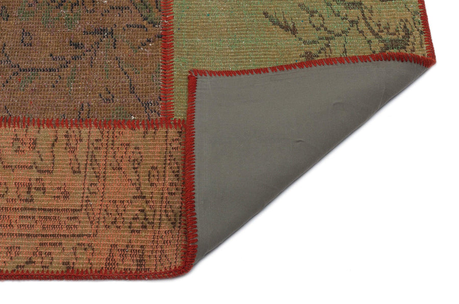 Handgewebter Wollteppich Braun Grün mit geometrischem Muster 120x181 cm – im Wohnzimmer