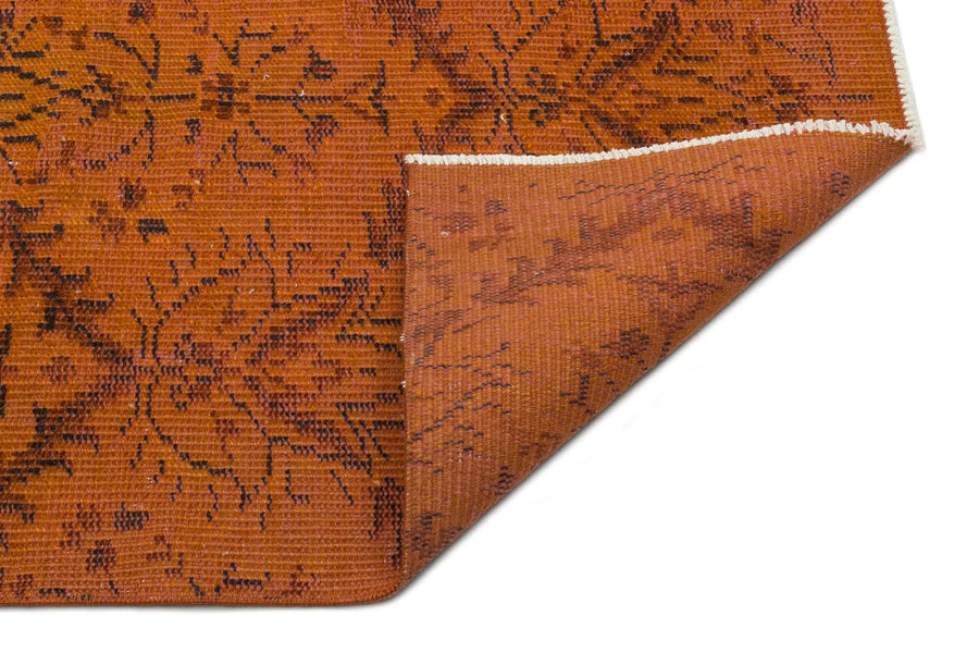 Geometric Orange & Brown Turkish Vintage Rug 146x248 cm (4'9" x 8'2") – in the living room