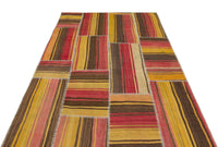 Żółty ręcznie tkany dywan wełniany ze wzorem geometrycznym 161x231 cm