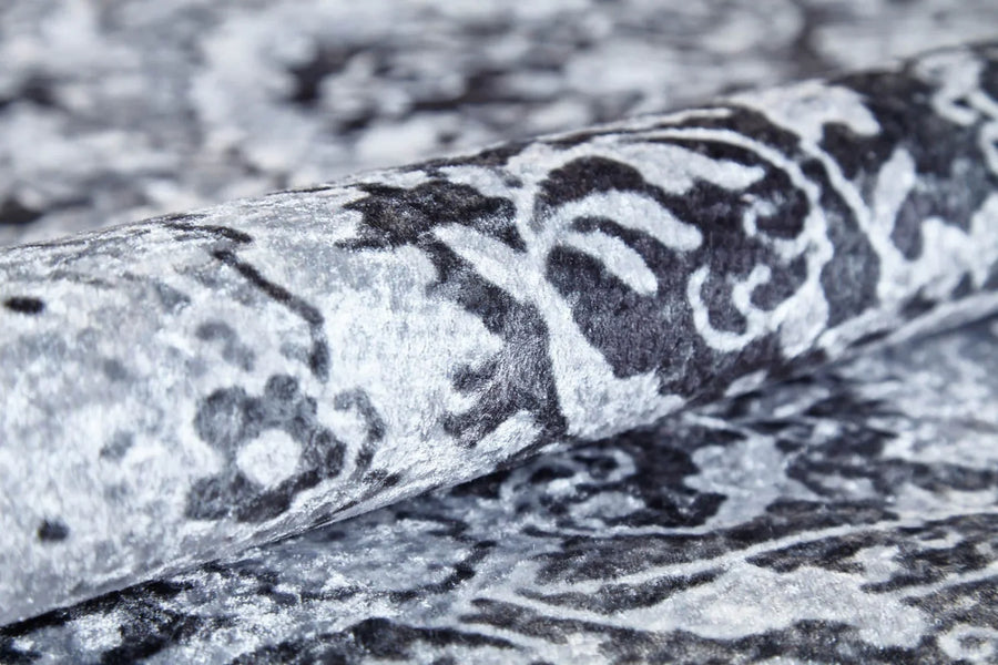 Charcoal Grey and White Checkered Area Rug – in the living room