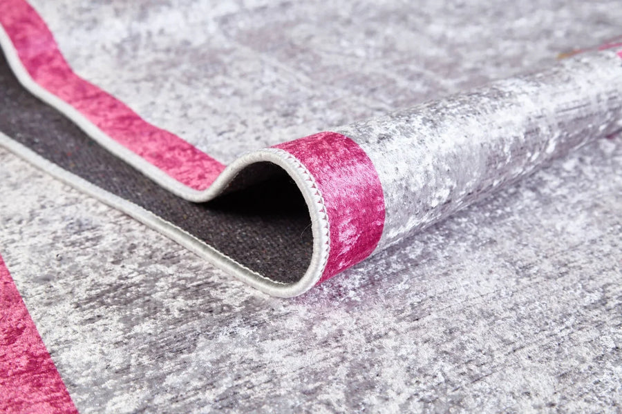 Modern Pink and Grey Plain Area Rug – in the living room