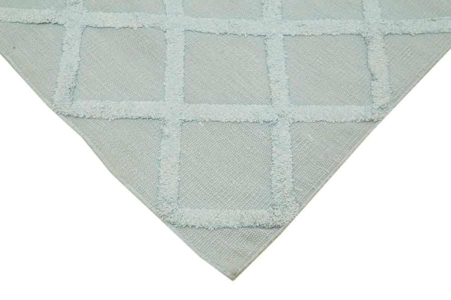 Blauer handgewebter Nepal Kelim mit geometrischem Muster 246x305 cm – im Wohnzimmer